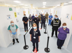 Photo of nursing and support staff in a clinical environment