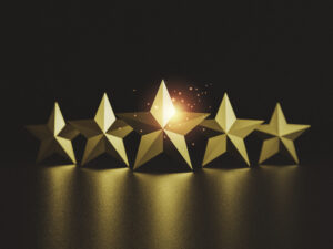 Gold five star on dark background 